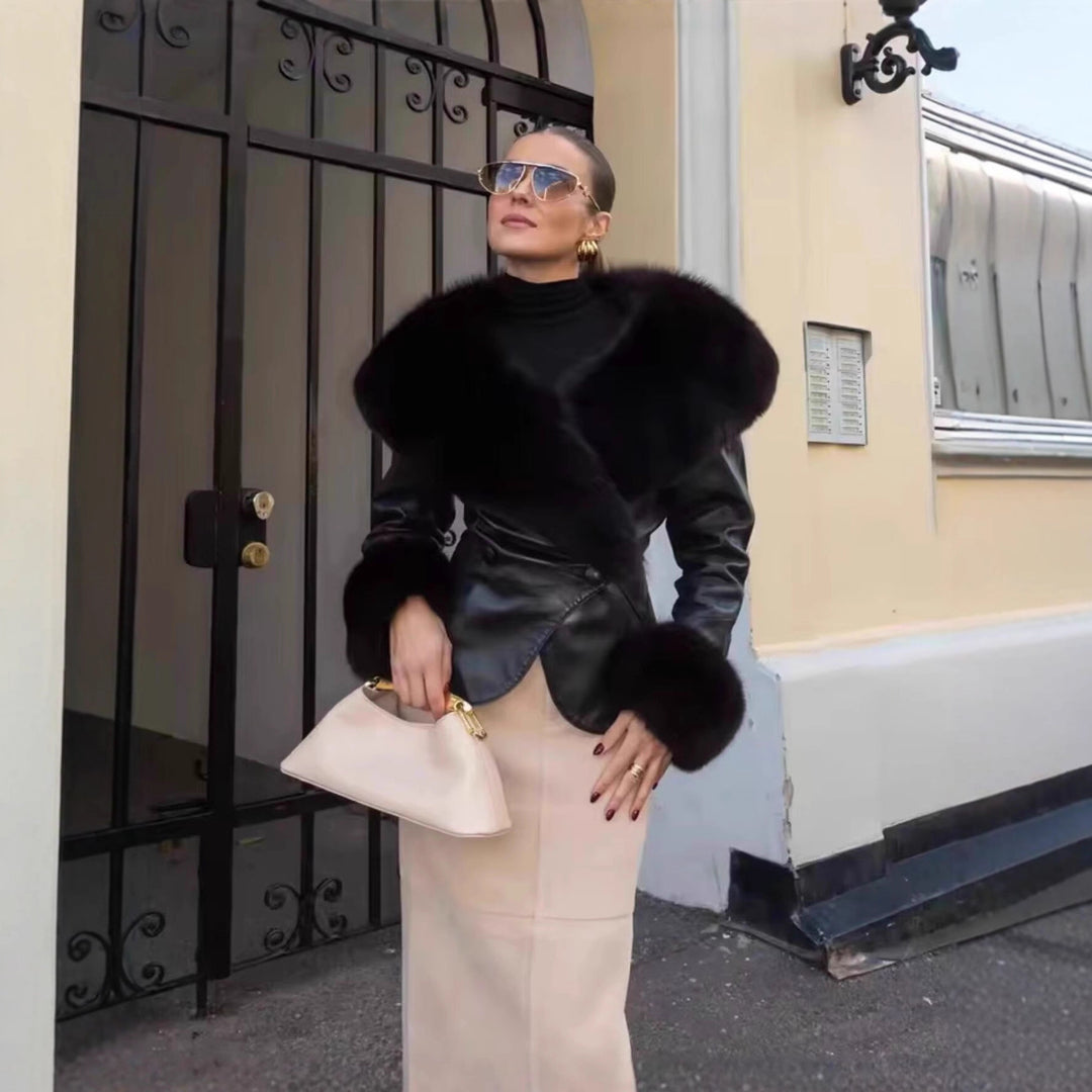 Women's short jacket made of synthetic leather with voluminous faux fur collar and fur cuffs Mune Fashion