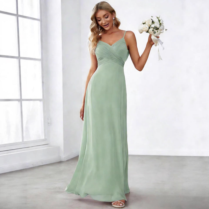 Ladies flowing chiffon evening dress with crossed draping, empire waist and fine spaghetti straps Mune Fashion