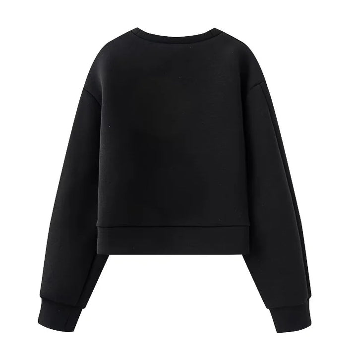 Women's oversized sweatshirt with decorative metal eyelets on the sleeves Mune Fashion