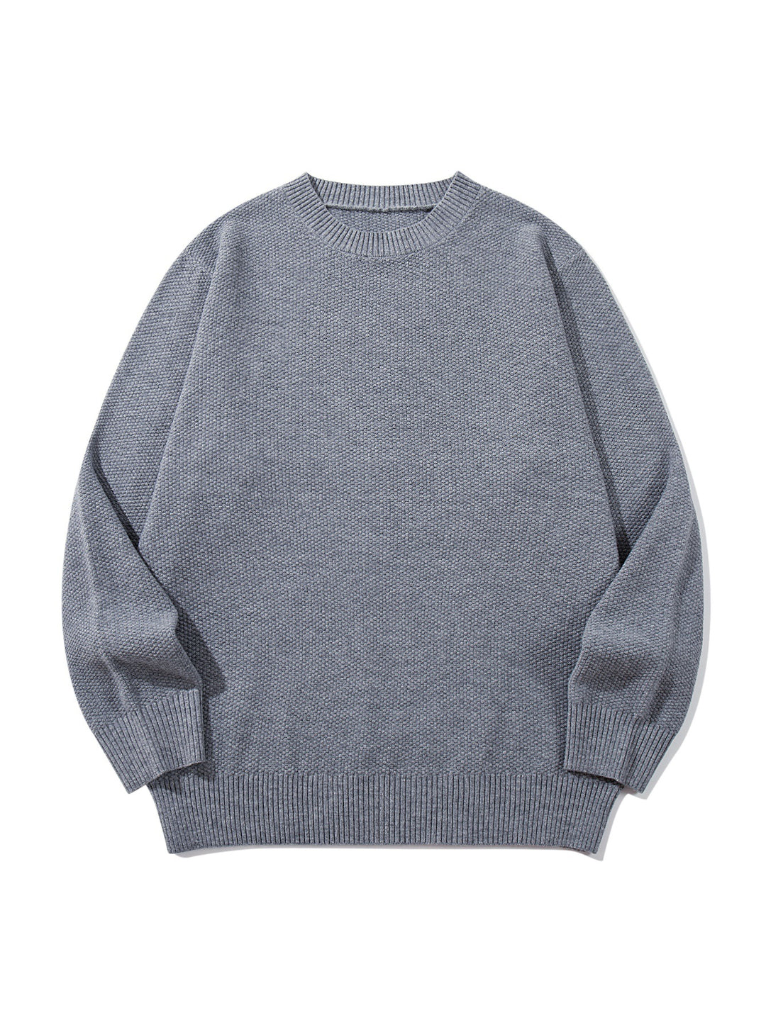 Unisex chunky knit round neck sweater with textured purl stitch and ribbed cuffs