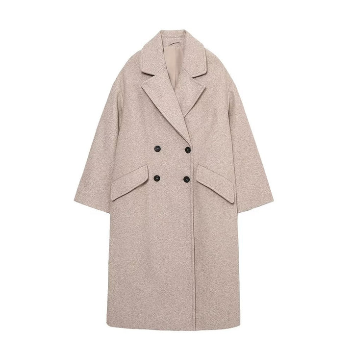 Women’s long cut boxy coat with double-breasted front, overlapping shawl collar, and generous flap pockets Mune Fashion