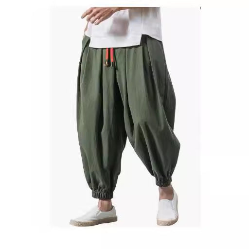 Men's wide-cut harem pants with low crotch, elastic waistband, and decorative drawstring Mune Fashion