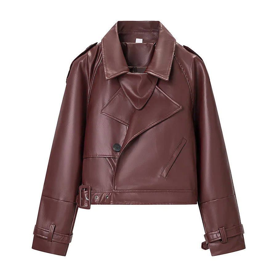 Women's short tailored biker jacket made of vegan leather imitation with shawl collar, waist belt and adjustable cuffs Mune Fashion