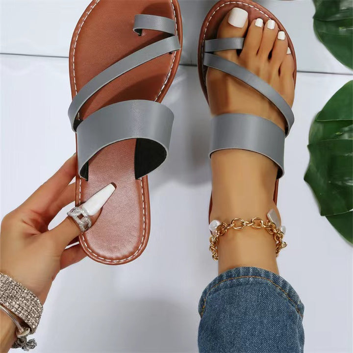 Women's flat faux leather thong sandal with crisscross straps and padded comfort footbed Mune Fashion