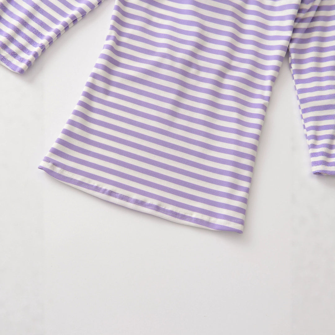 Women's striped long-sleeve shirt with deep round neckline and decorative bow tie