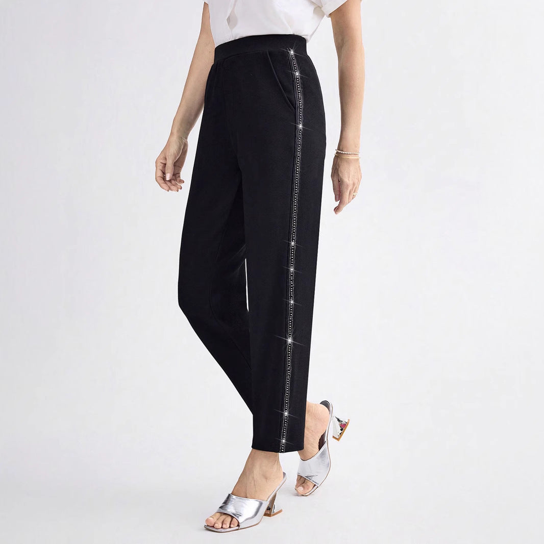 Women Elegant straight-cut fabric pants with elastic waistband and side glitter trim Mune Fashion