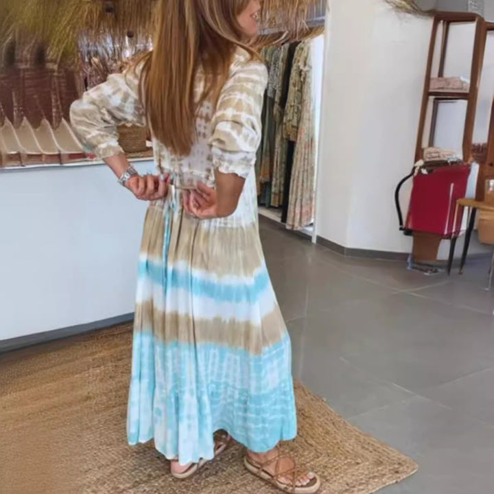 Women's airy batik tiered dress with V-neck, empire waist, and elastic sleeves Mune Fashion