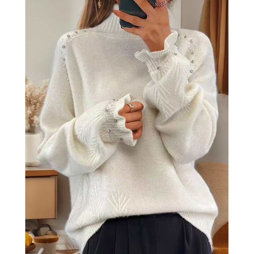 Ladies oversized knit sweater with stand-up collar and pearl details Mune Fashion