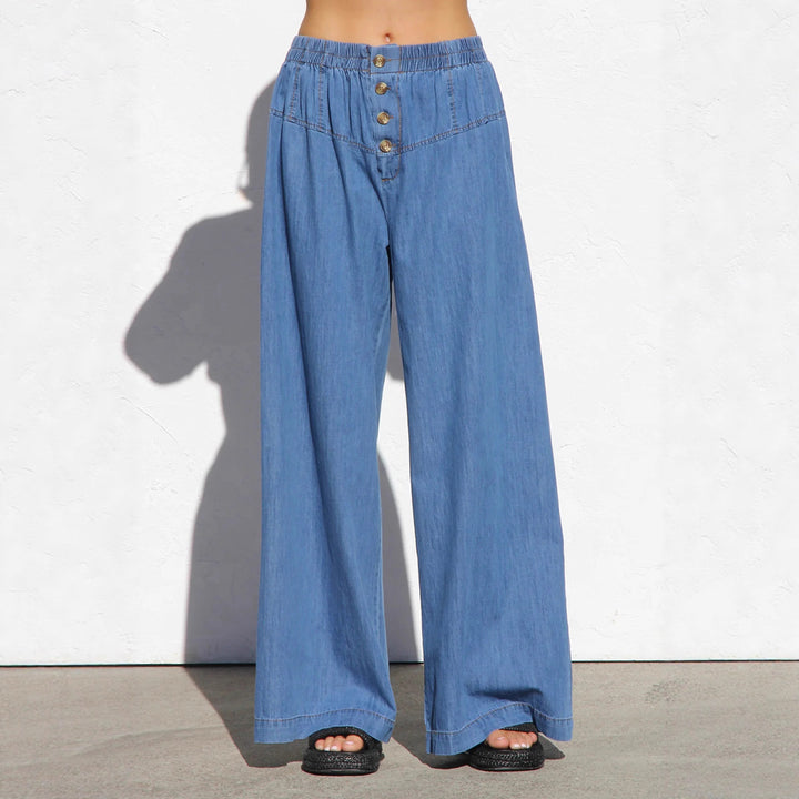 Women's wide high-waisted jeans with elastic waistband and decorative button placket Mune Fashion