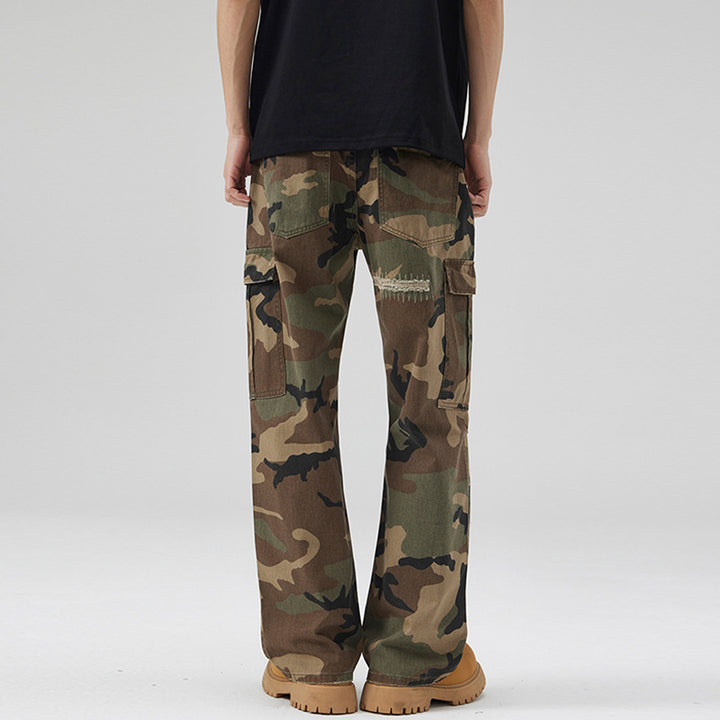 Men's loose cargo pants in camouflage look with deliberately ripped details and large flap pockets Mune Fashion