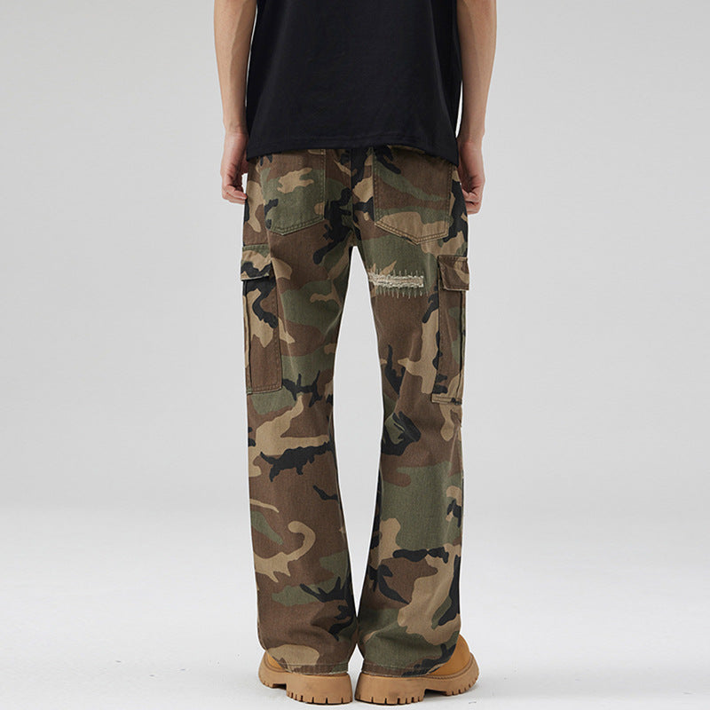 Men's loose cargo pants in camouflage look with deliberately ripped details and large flap pockets Mune Fashion