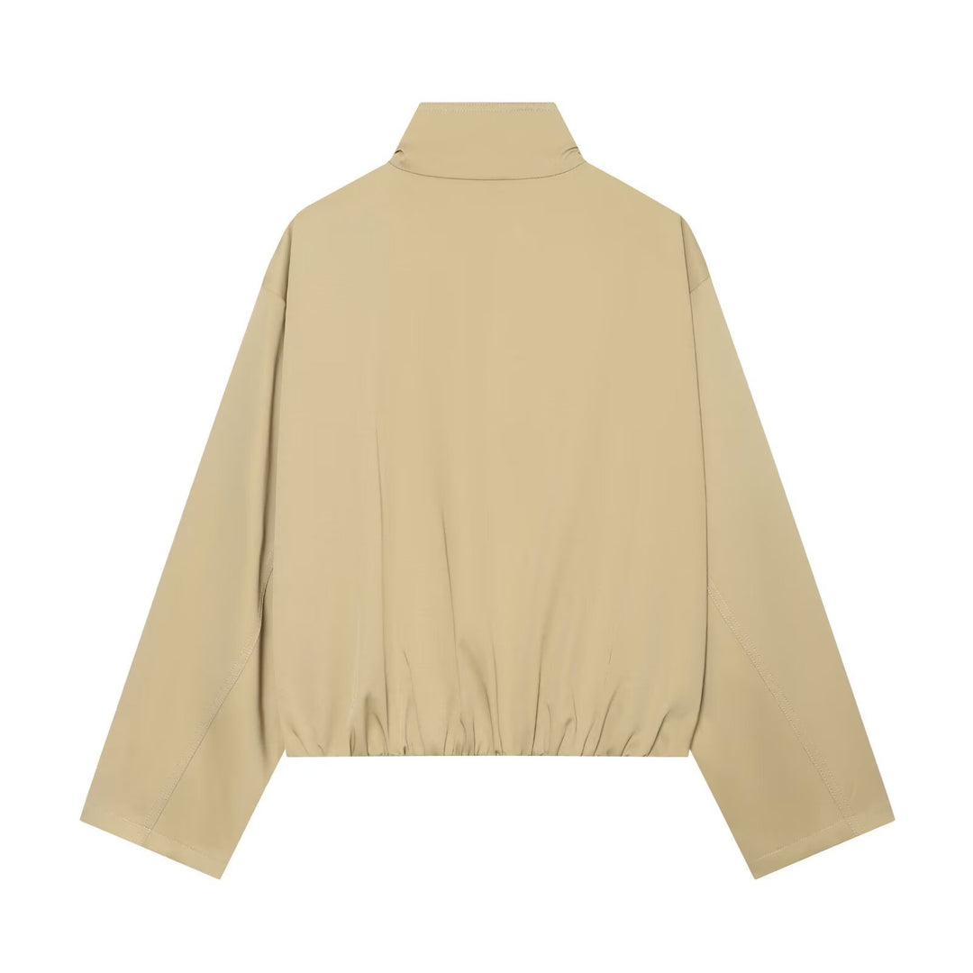 Women's short double-breasted trench bomber jacket with stand-up collar, tab, and elastic hem Mune Fashion