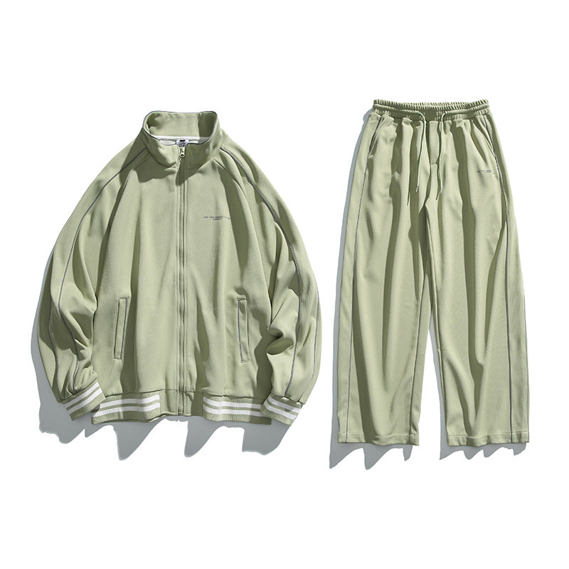 Unisex Sportive Track Jacket in oversized cut with stand-up collar, contrast piping and ribbed cuffs Mune Fashion