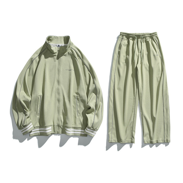 Unisex Sportive Track Jacket in oversized cut with stand-up collar, contrast piping and ribbed cuffs Mune Fashion