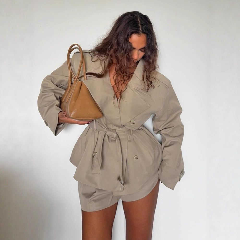 Women's short trench-style jacket with a tailored tie belt and wide sleeves Mune Fashion