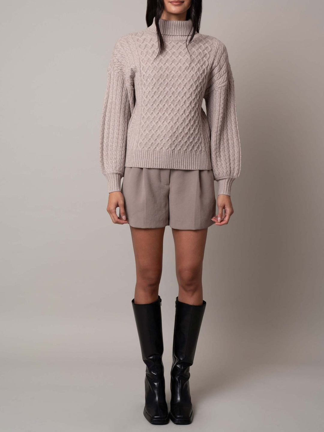 Women's stylish knitted sweater with high collar