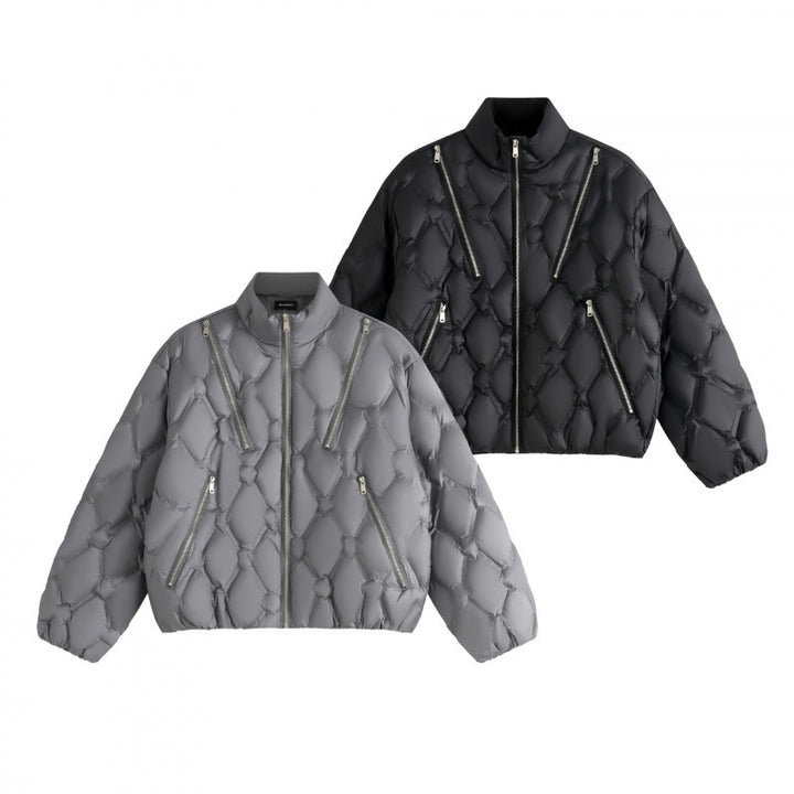 Unisex short cut quilted jacket in boxy cut with diamond quilting and diagonal zip pockets Mune Fashion