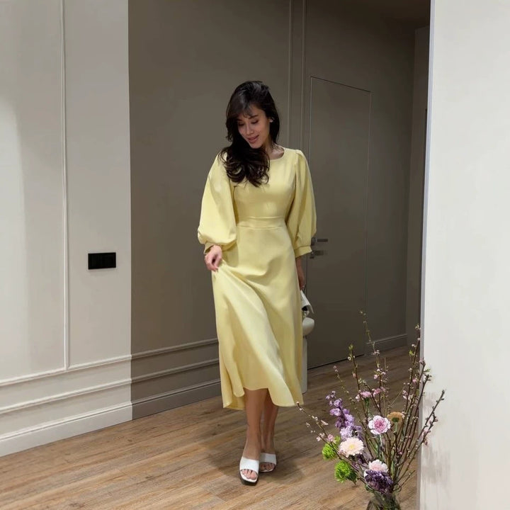 Women's midi dress with open back cutout, voluminous puff sleeves and tie belt Mune Fashion