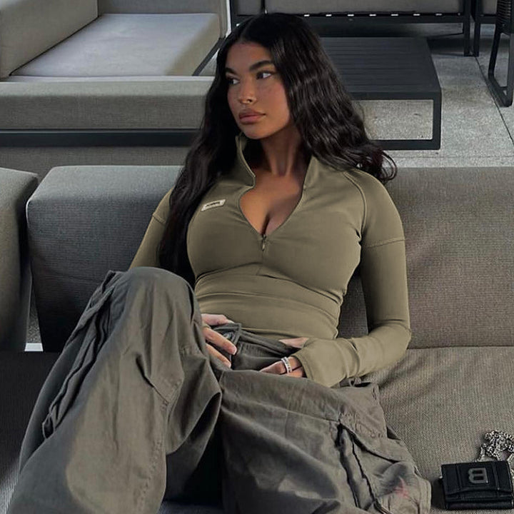 Women's form-fitting long sleeve zip top with deep V-neck and elastic functional stretch Mune Fashion