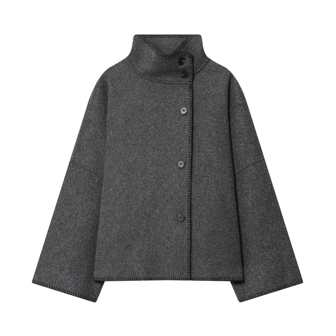 Ladies oversized wool cape jacket with high collar and asymmetrical button placket Mune Fashion