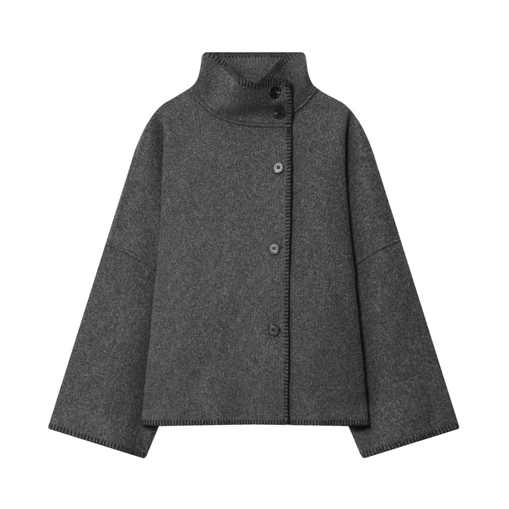 Ladies oversized wool cape jacket with high collar and asymmetrical button placket Mune Fashion