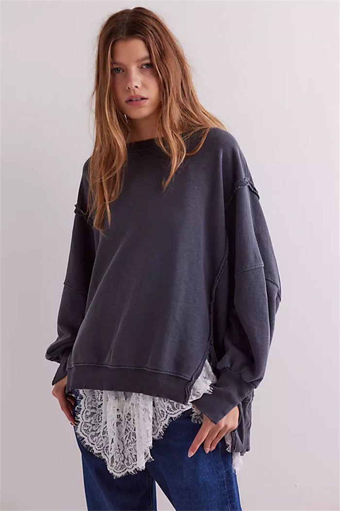Women's oversized sweatshirt with balloon sleeves, open seam stitches, and side slits Mune Fashion