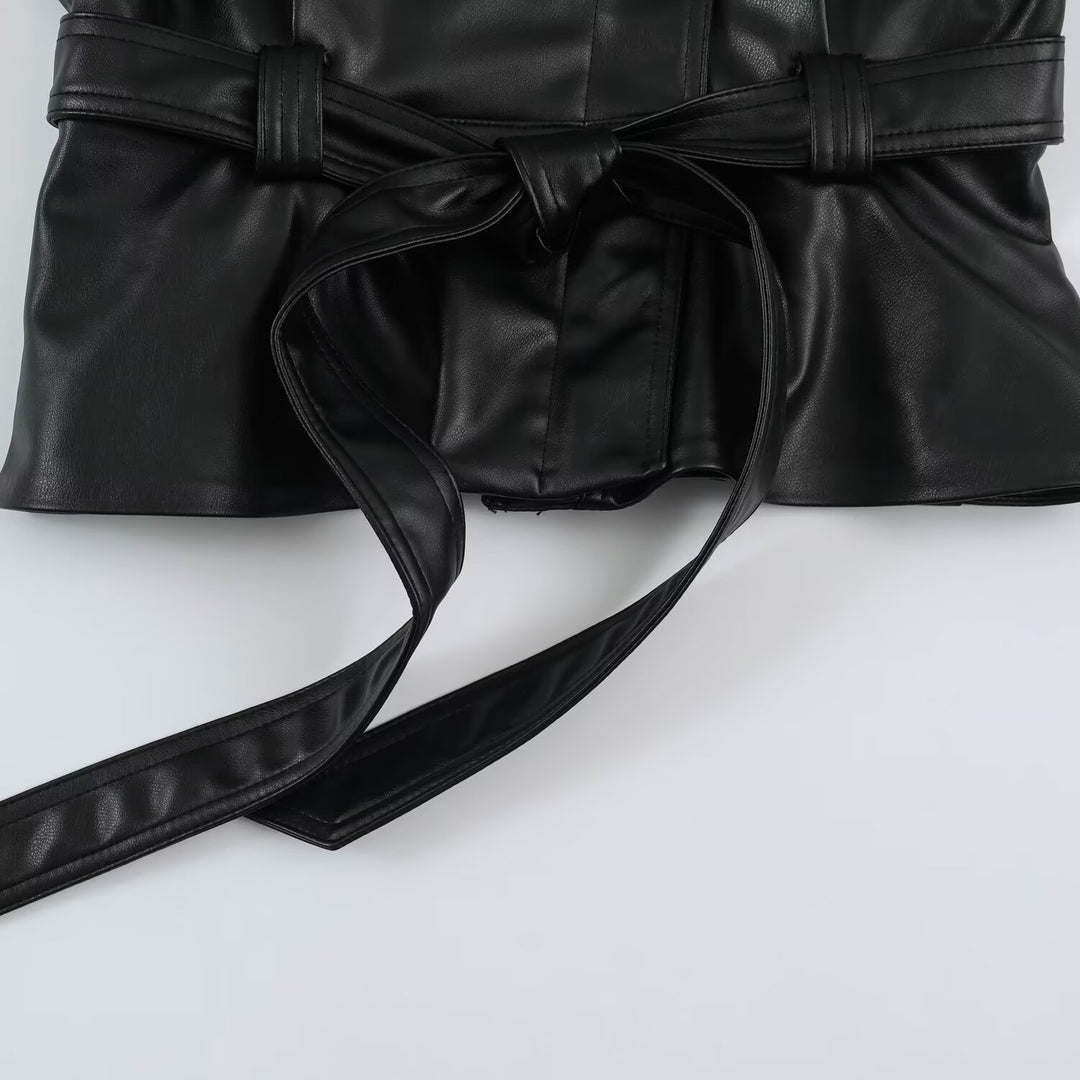 Women’s short jacket made of faux leather with a waist belt and oversized sleeves Mune Fashion
