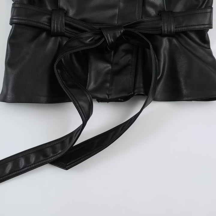 Women’s short jacket made of faux leather with a waist belt and oversized sleeves Mune Fashion
