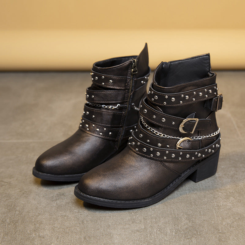 Women's ankle-height biker ankle boots with studded strap, chain and buckle details Mune Fashion