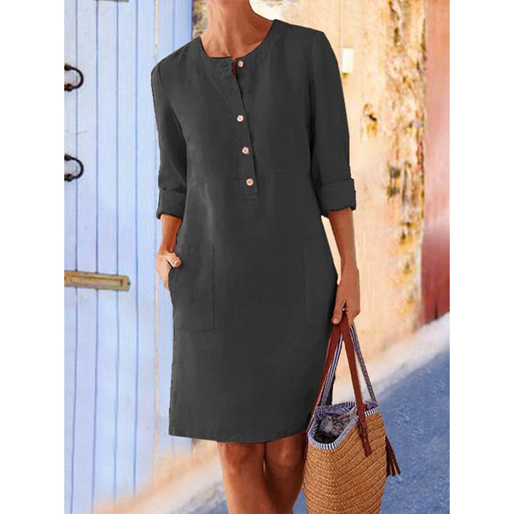 Women loose-fitting linen-look dress with three-quarter sleeves, button placket and side pockets Mune Fashion