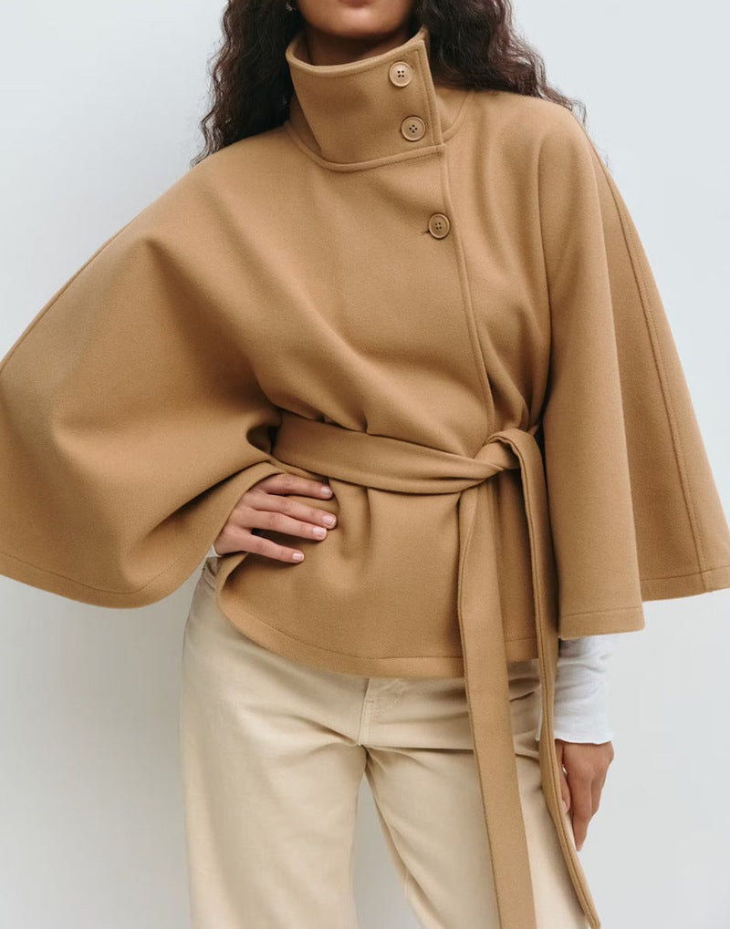 Women's short cape jacket with high stand-up collar, tie belt and boxy silhouette Mune Fashion