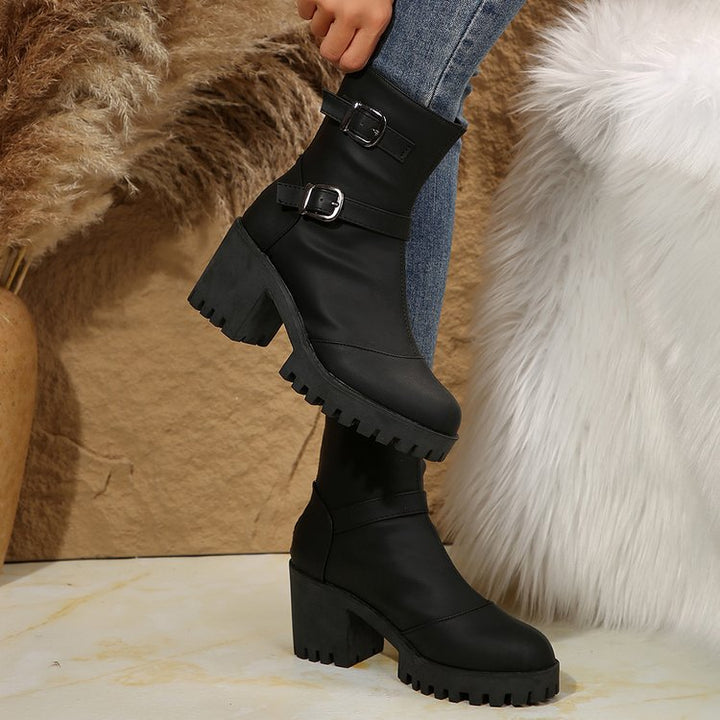 Women's chunky biker ankle boots with a profiled sole, decorative double buckles, and a side zipper Mune Fashion