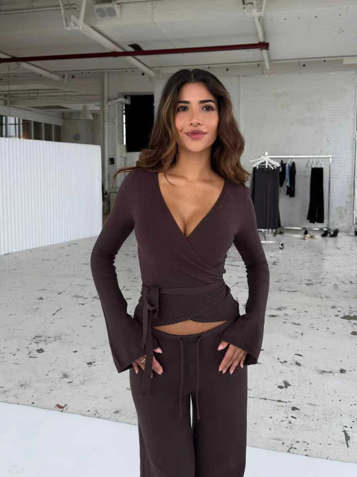 Women's knitted wrap top with tie belt and trumpet sleeves, as well as high-waisted wide-cut knitted pants Mune Fashion