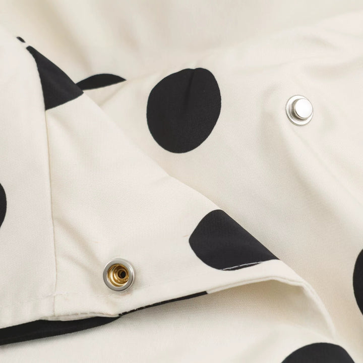 Women's lightweight dotted rain jacket in oversized cropped cut with high funnel collar Mune Fashion
