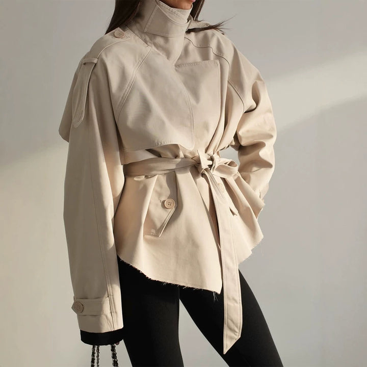 Women's short trench coat with wide standing collar, shoulder epaulettes, and waist belt Mune Fashion