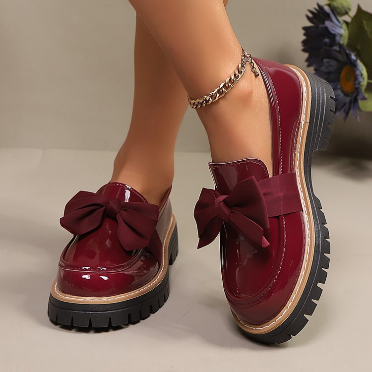 Ladies patent look loafer with massive profile sole and large fabric bow Mune Fashion