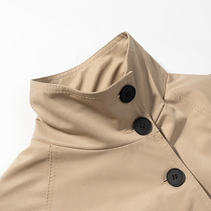 Women's short trench coat with high standing collar, fitted tie belt, and double-breasted button placket Mune Fashion
