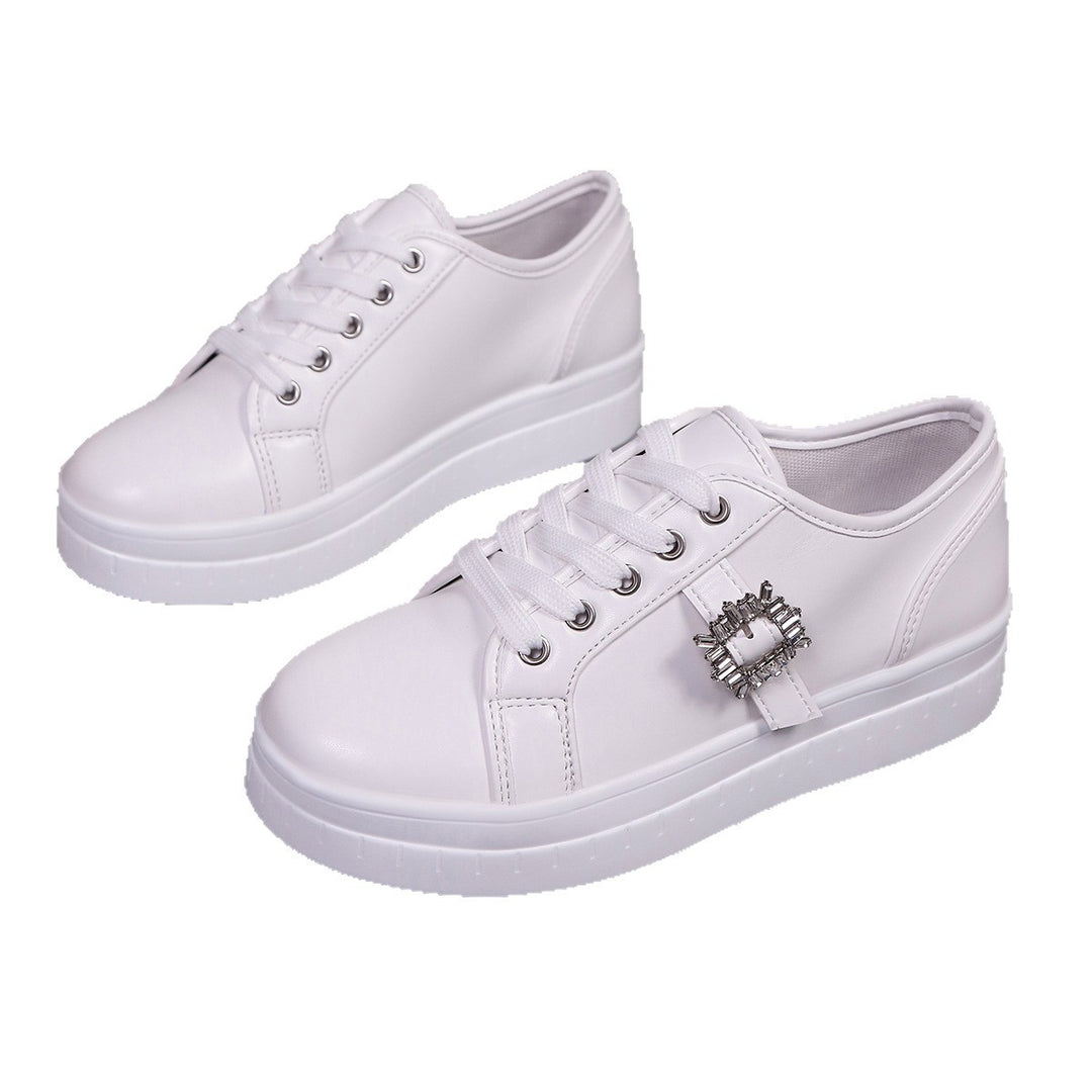 Ladies' platform sneaker with metallic upper material, decorative rhinestone buckle, and padded comfort sole Mune Fashion
