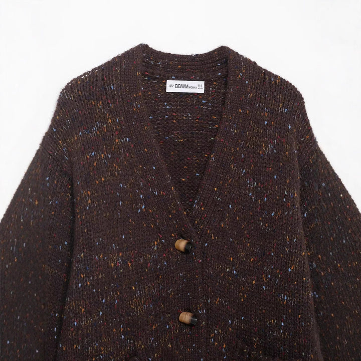 Women’s chunky knit cardigan with horn button front and patch pockets Mune Fashion