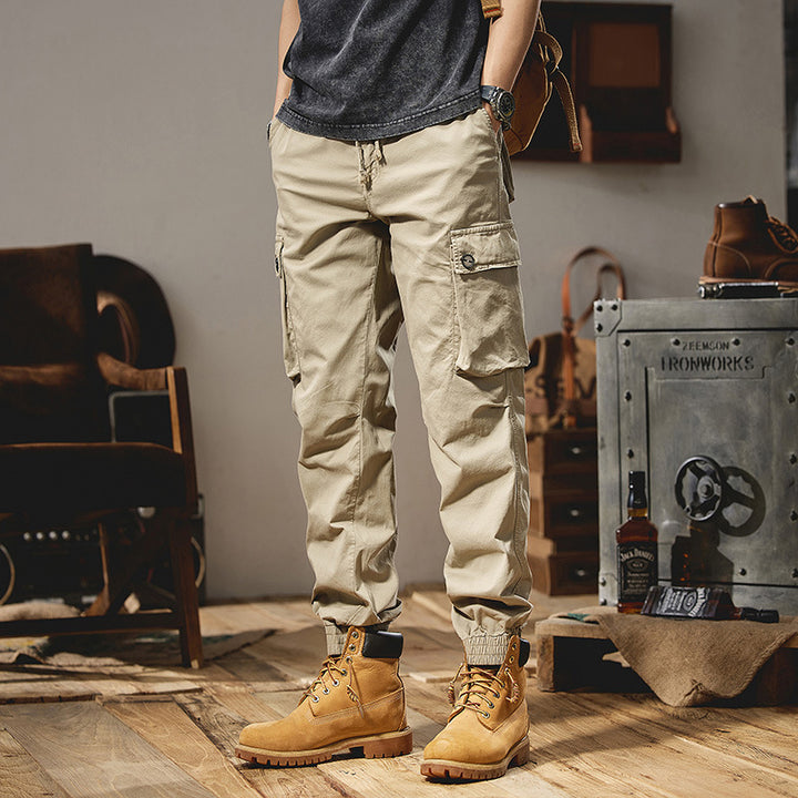 Men's robustly constructed cargo pants in jogger style with drawstring waistband, flap pockets, and elastic ankle cuffs Mune Fashion