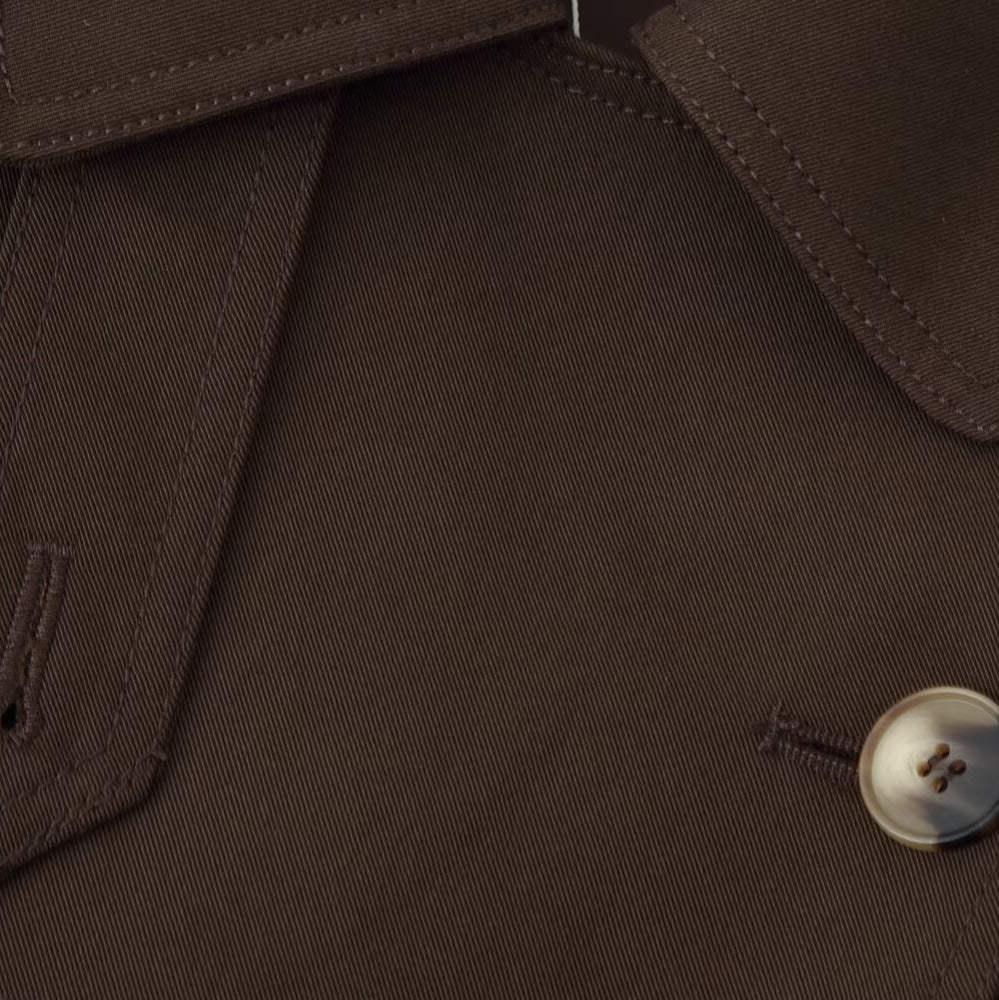Women's short trench-style jacket with tie belt, raglan sleeves, and tailored fit Mune Fashion
