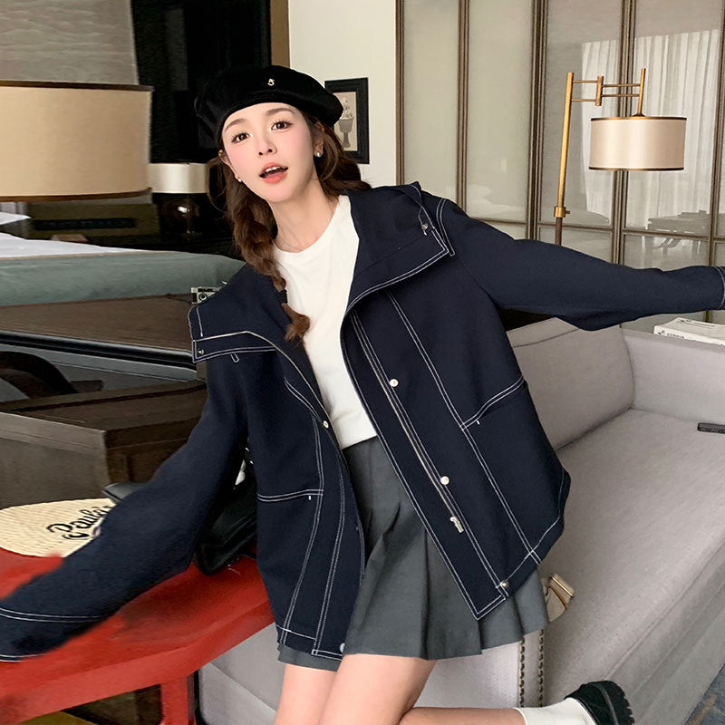 Women's short jacket with high stand-up collar, contrasting decorative seams and boxy oversized silhouette Mune Fashion