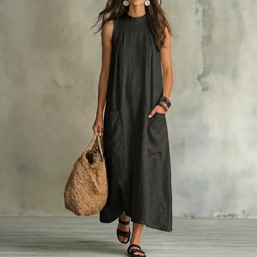 Women’s sleeveless linen maxi dress with standing collar, pleats at the chest, and piled pockets Mune Fashion