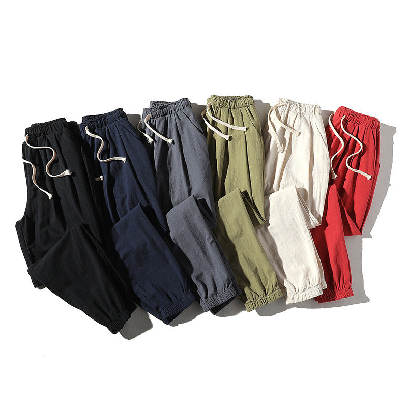 Men's loose joggers with elastic waistband, drawstring, side pockets, and elastic cuffs Mune Fashion