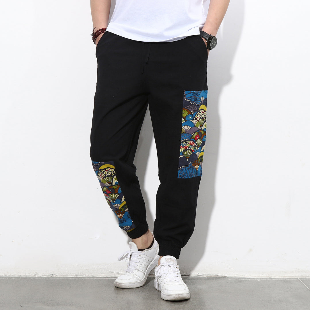 Men's jogging pants with side panel prints, drawstring and ribbed cuffs Mune Fashion