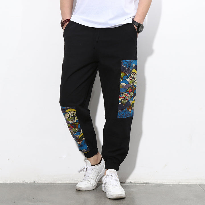 Men's jogging pants with side panel prints, drawstring and ribbed cuffs Mune Fashion