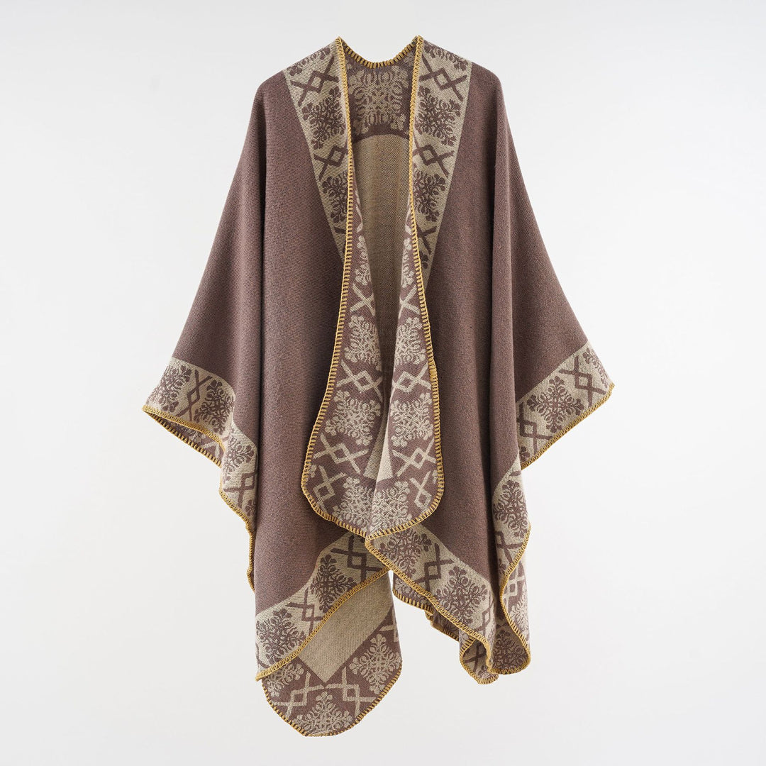 Women's oversized poncho cape made of wool blend with woven border jacquard and decorative chain stitch