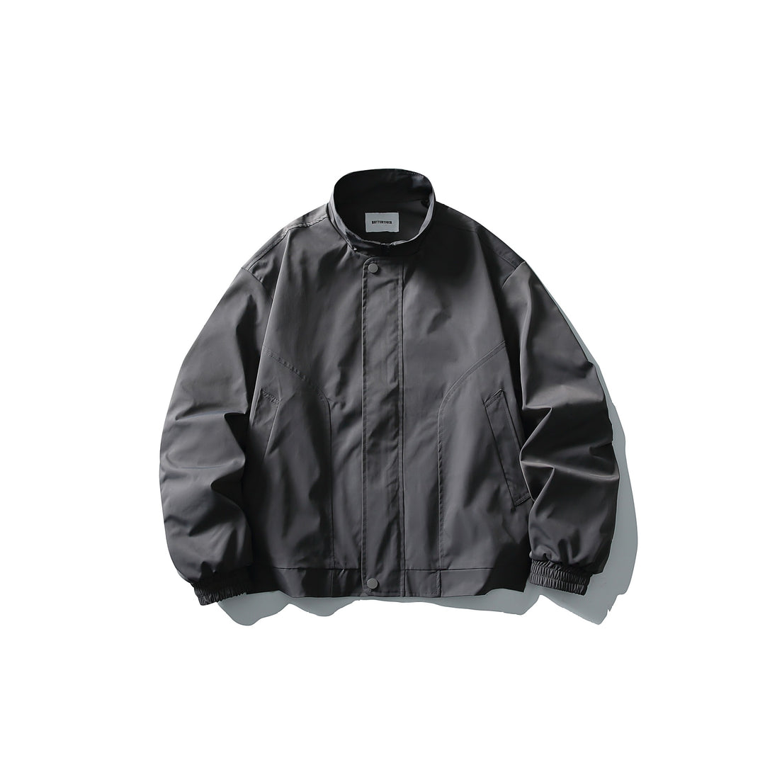 Unisex Short Cut Technical Boxy Bomber with Stand-up Collar, Snap Placket and Elastic Cuffs Mune Fashion