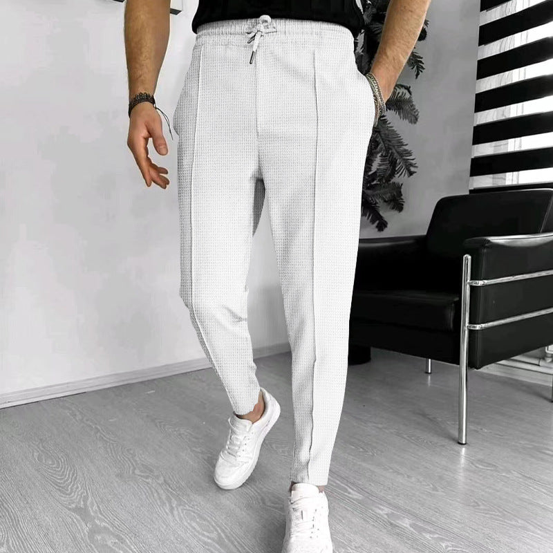 Men's tapered jogging chinos made of structured woven quality with elastic drawstring waistband and decorative crease Mune Fashion