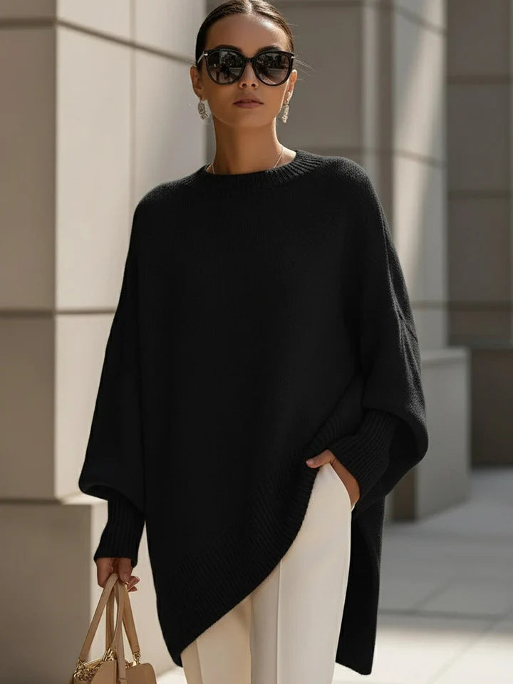 Women's oversized knit poncho with asymmetrical hem and ribbed sleeves Mune Fashion